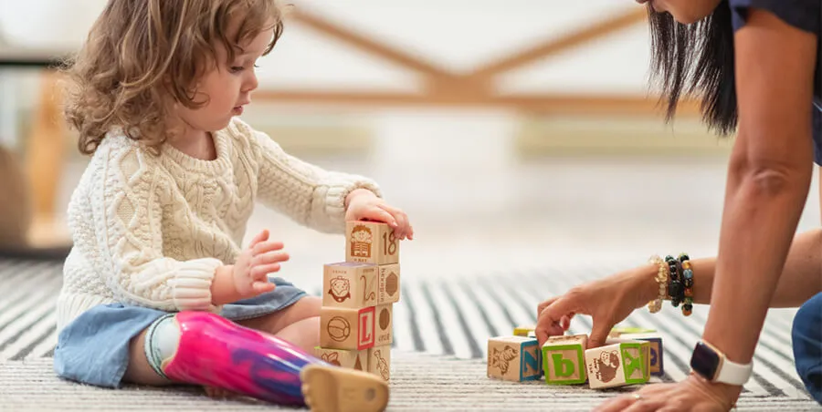 Child playing with wooden blocks